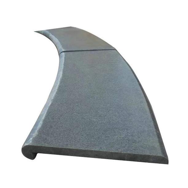 Curved black basalt pool coping with a bullnose edge, for freeform pools