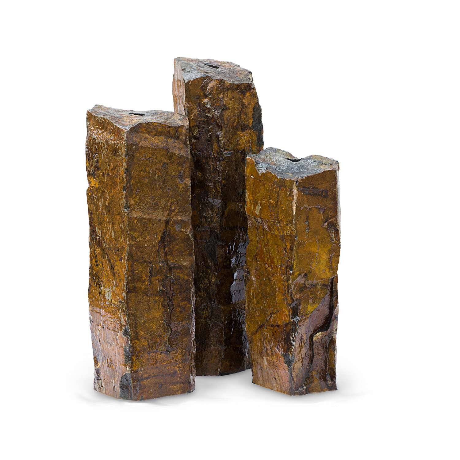 Set of three natural basalt columns with rust-toned skin, cut to staggered heights